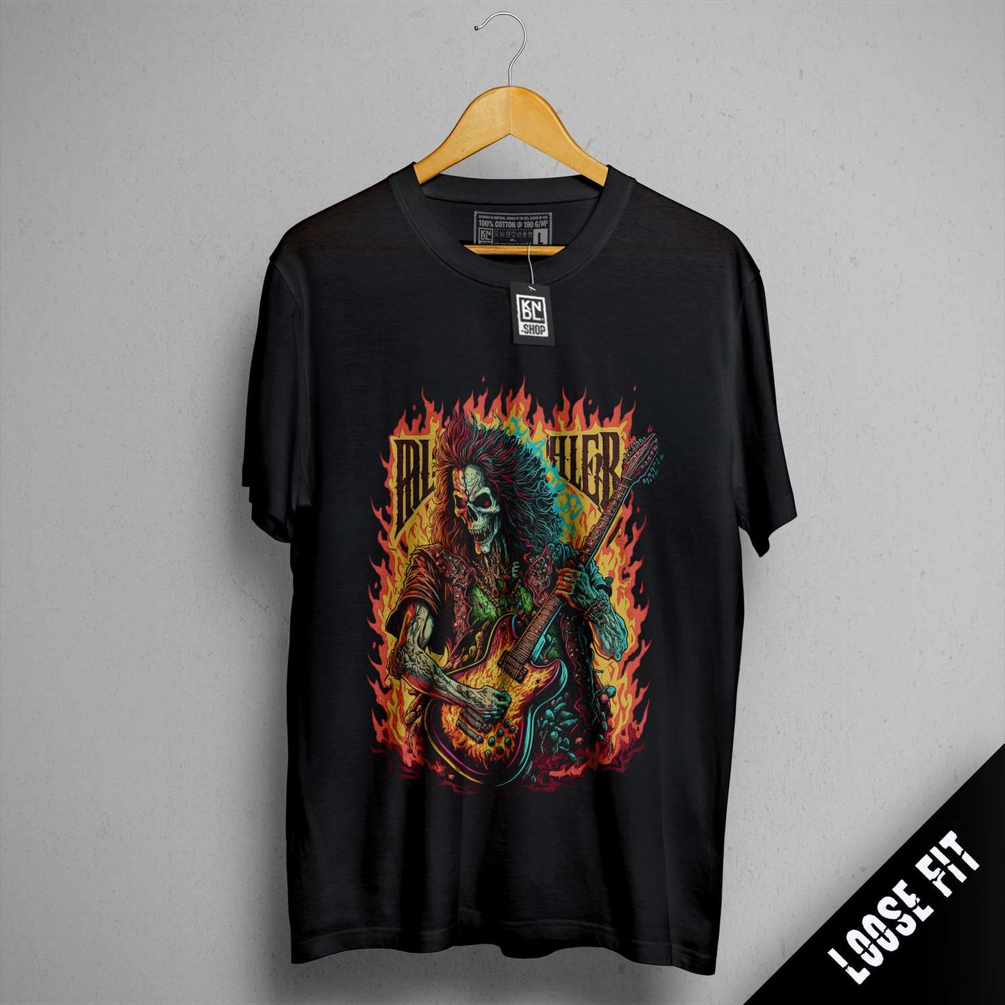 a black shirt with a picture of a skeleton playing a guitar