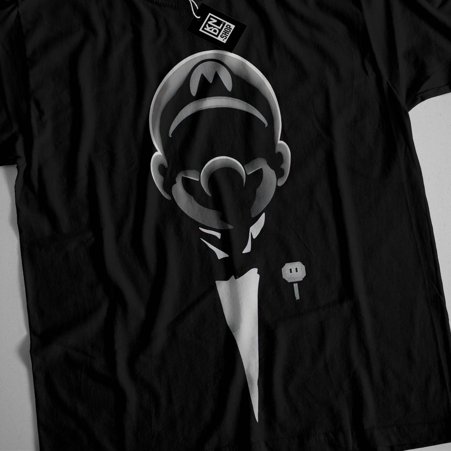 a black t - shirt with a picture of a man's face on it