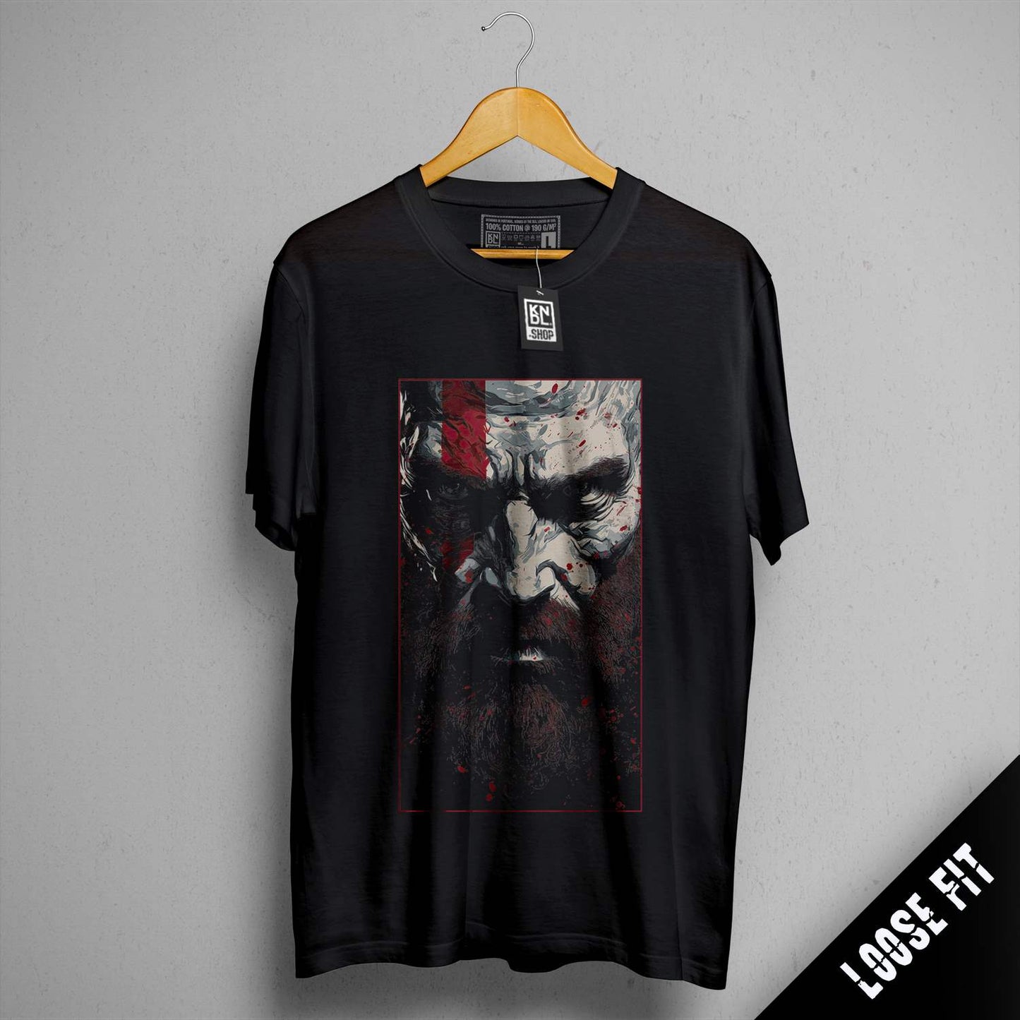 a black t - shirt with a picture of a man with a beard