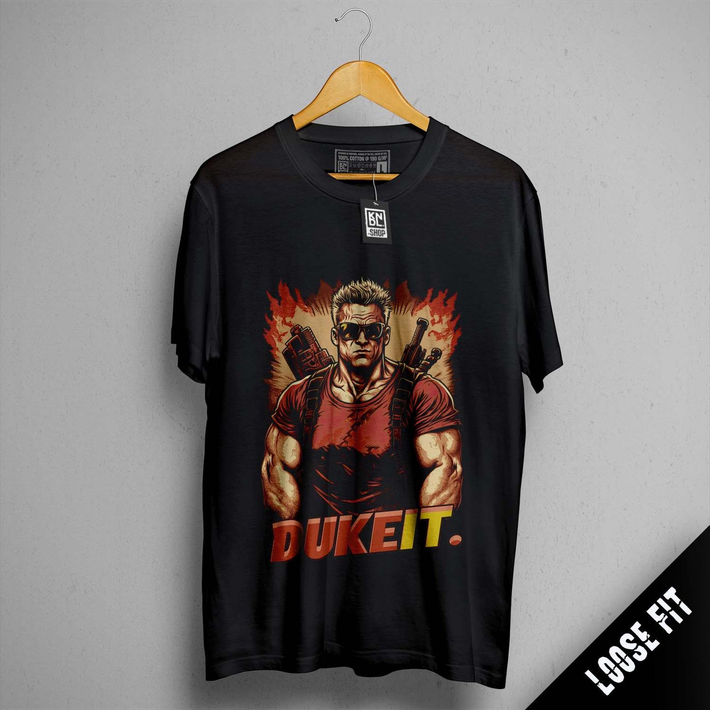 a black shirt with a picture of a man holding a gun