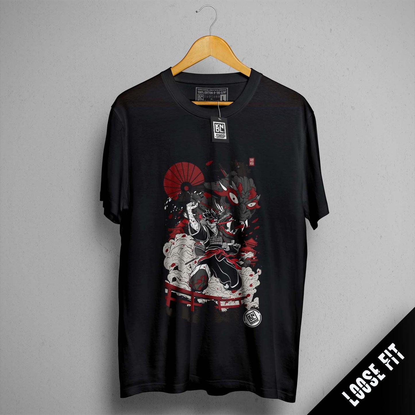 a black t - shirt with a picture of a man riding a motorcycle