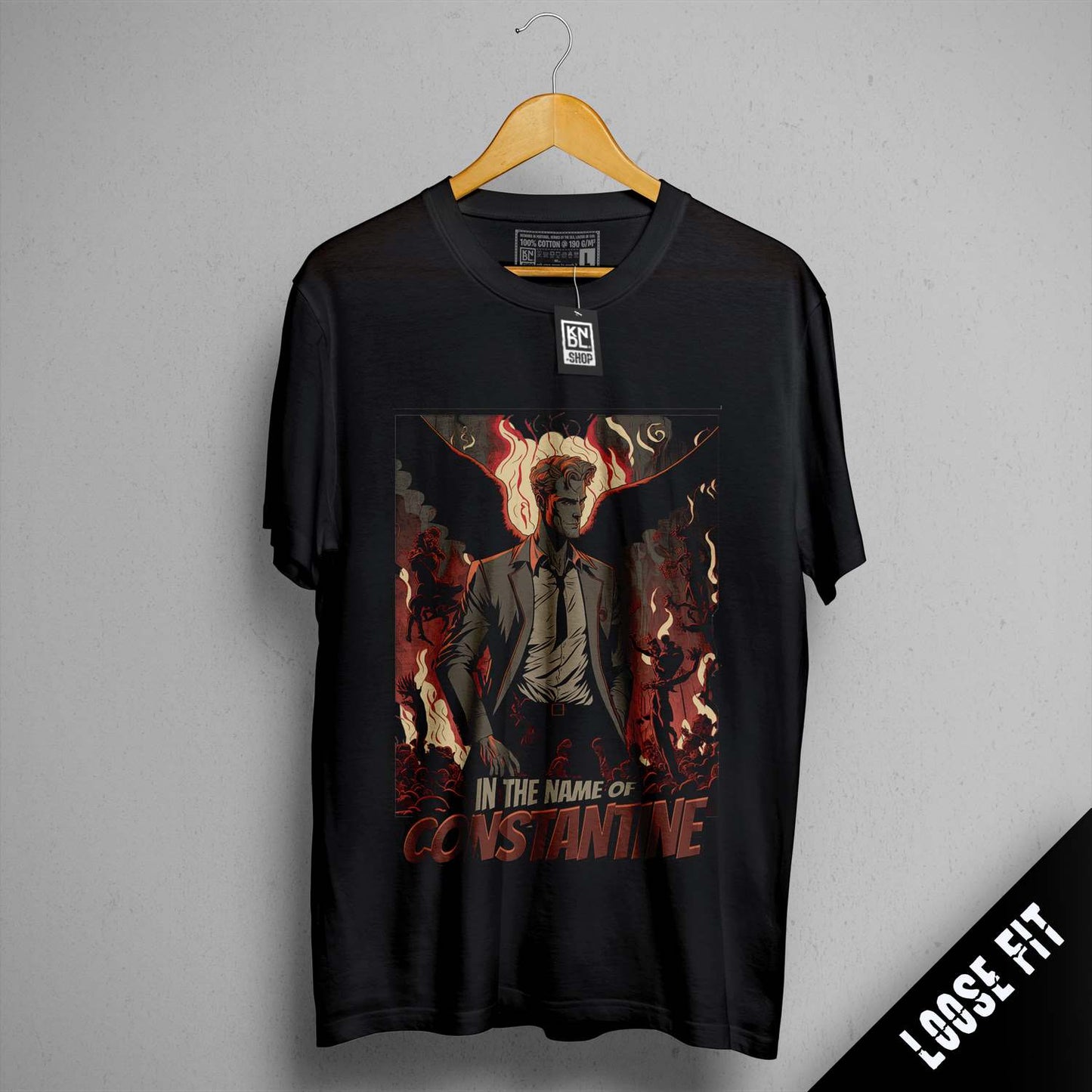 a black t - shirt with a picture of a man holding a gun