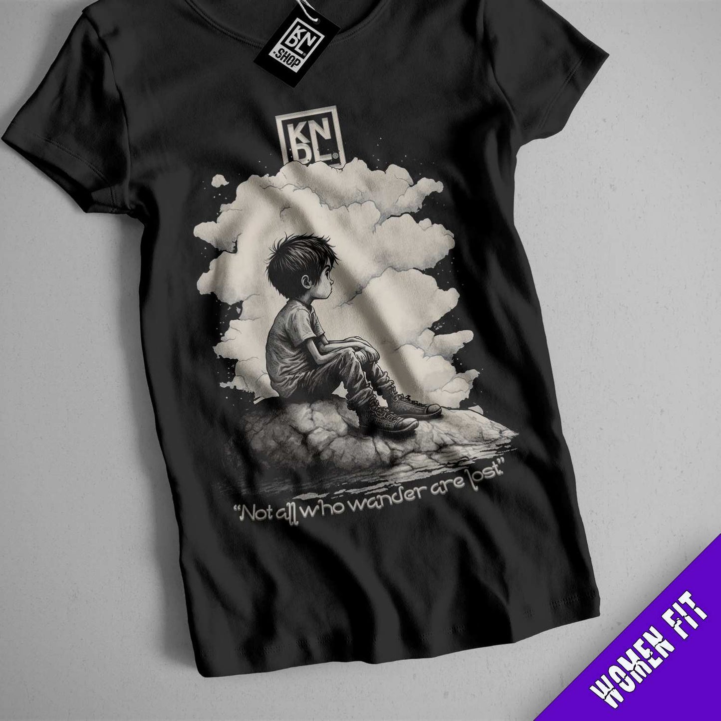 a black shirt with a picture of a boy sitting on a cloud