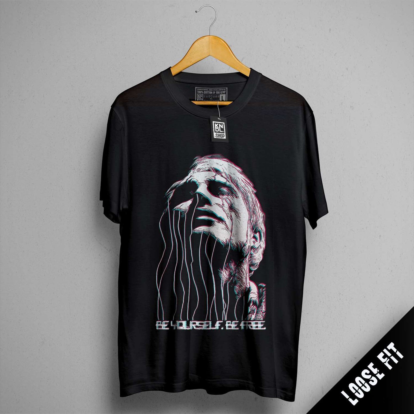 a black t - shirt with a picture of a man's face on it