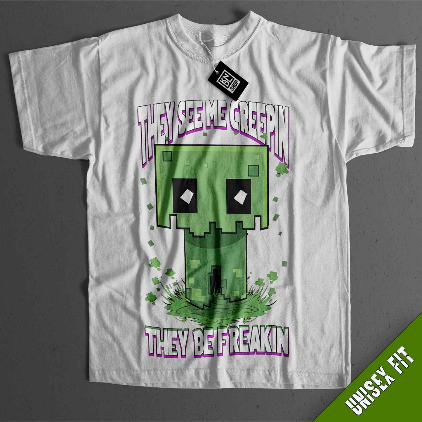 a white t - shirt with an image of a green creature on it