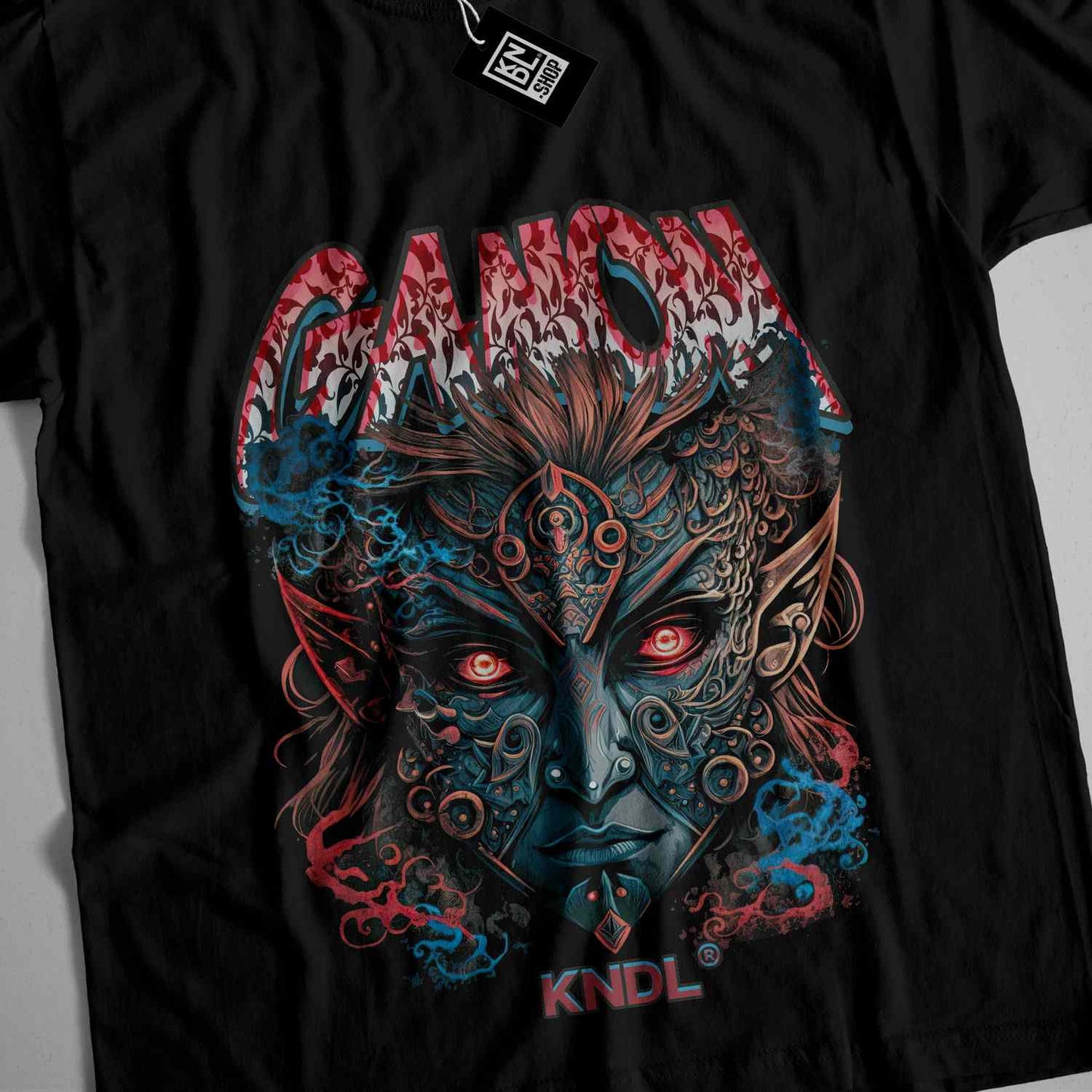 a black t - shirt with an image of a demon on it