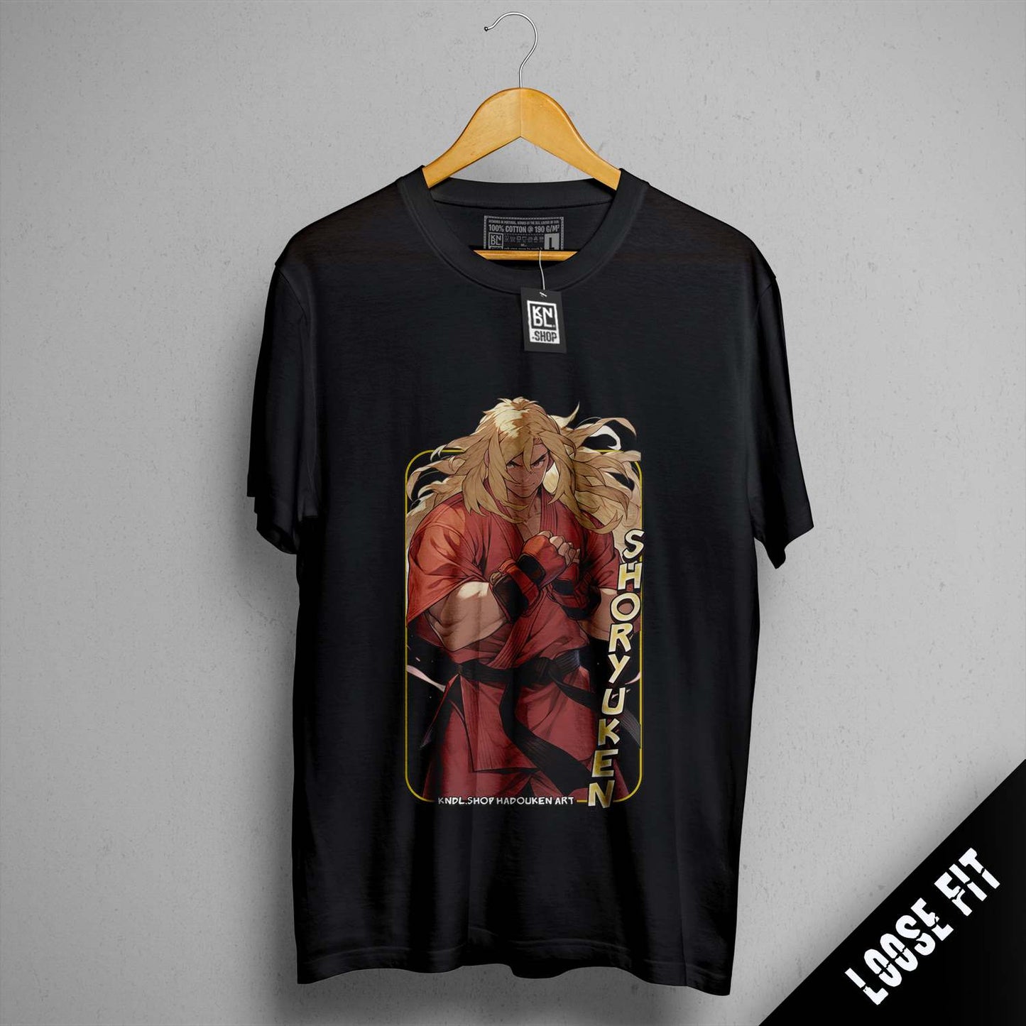 a black shirt with a picture of a woman holding a gun
