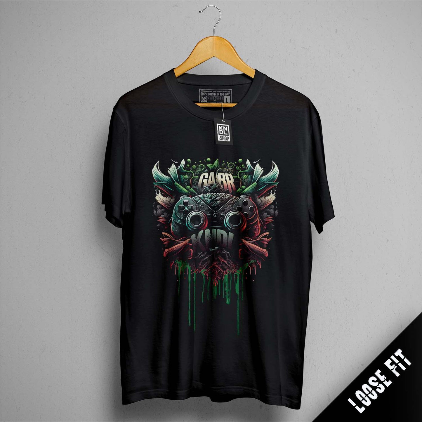 a black t - shirt with an image of a demon on it