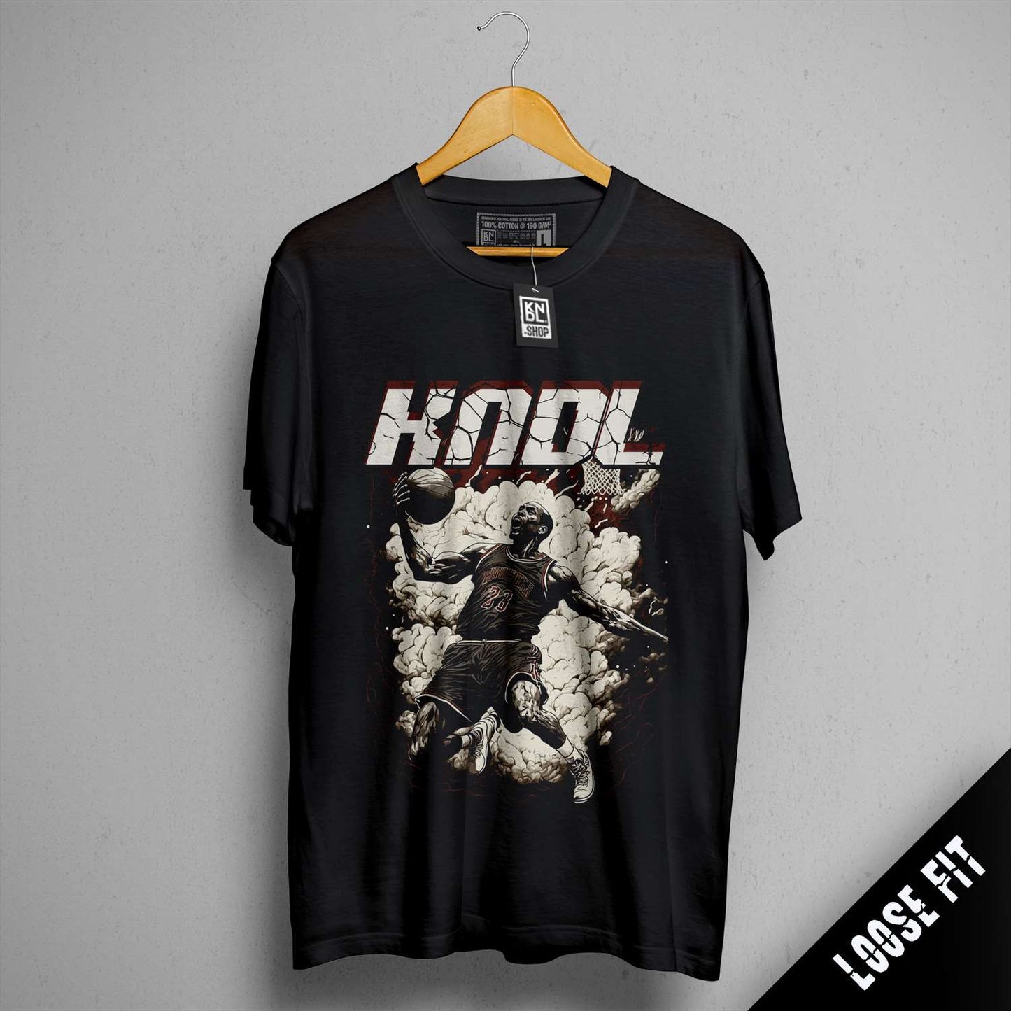 a black t - shirt with a picture of a man holding a soccer ball