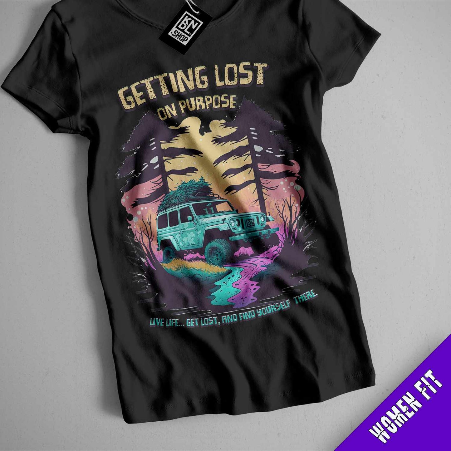 a black t - shirt with an image of a jeep driving through a forest