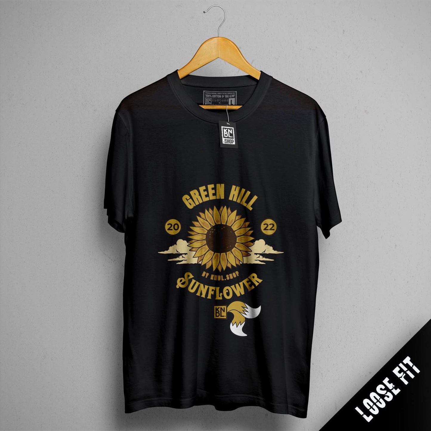 a black t - shirt with a yellow sunflower on it