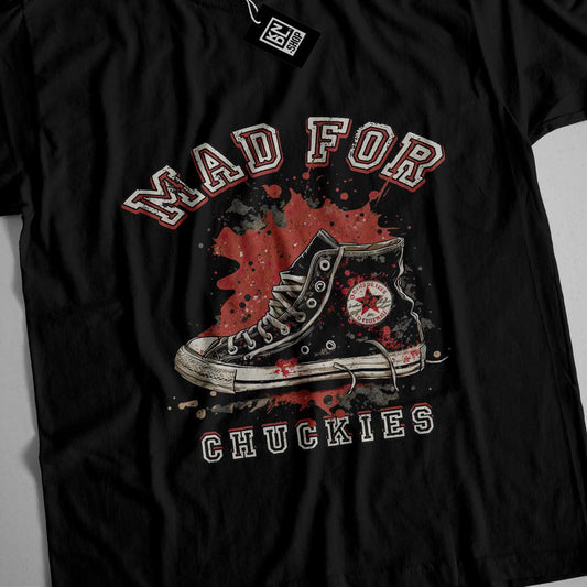 a black t - shirt with a picture of a pair of shoes on it