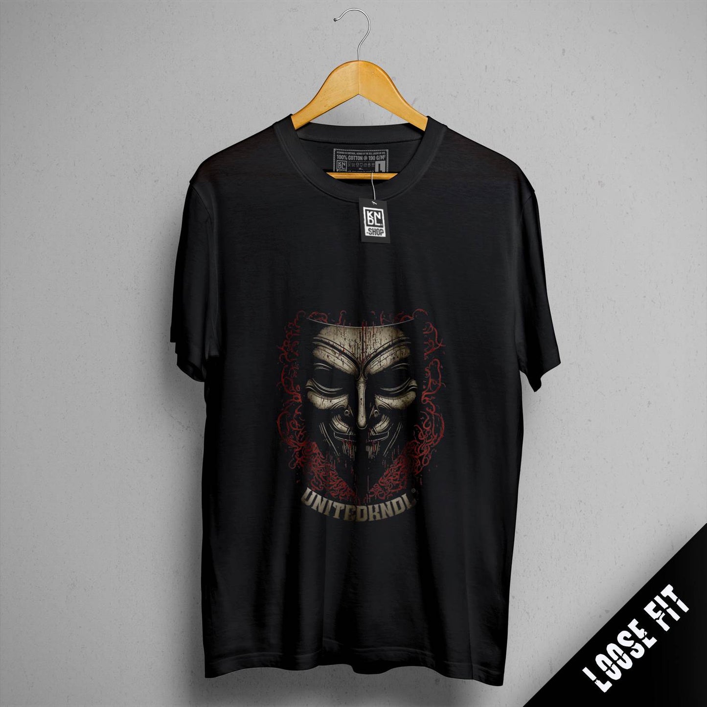 a black t - shirt with a skull on it