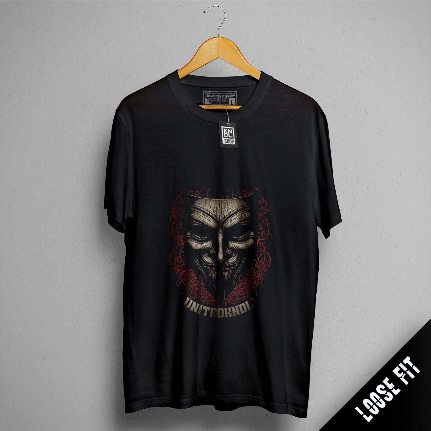a black t - shirt with a skull on it