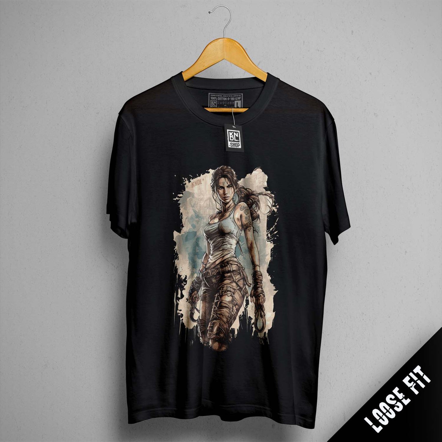 a black shirt with a picture of a woman holding a gun