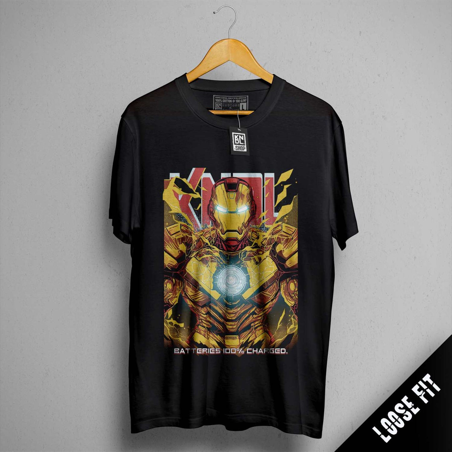 a black iron man t - shirt hanging on a wall