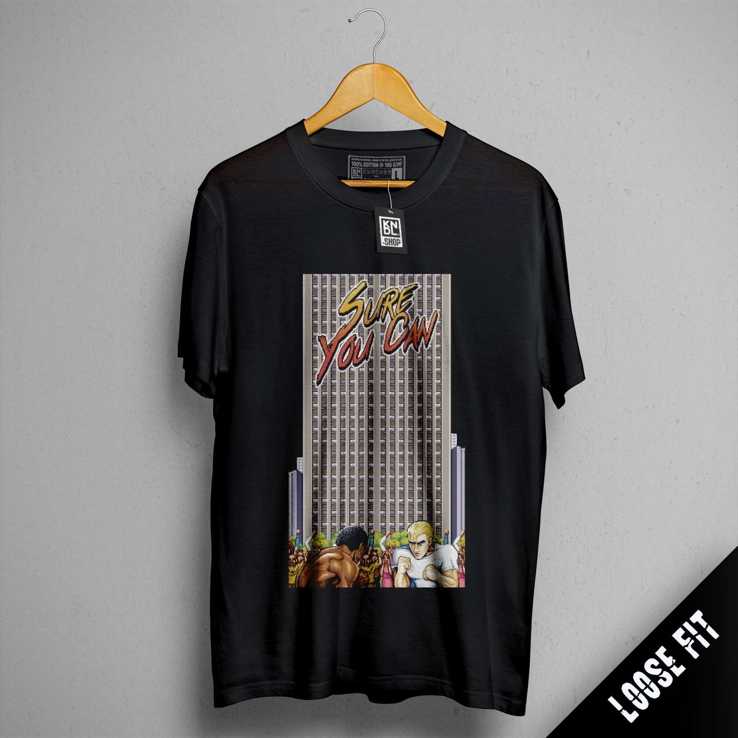 a t - shirt hanging on a wall with a picture of a city