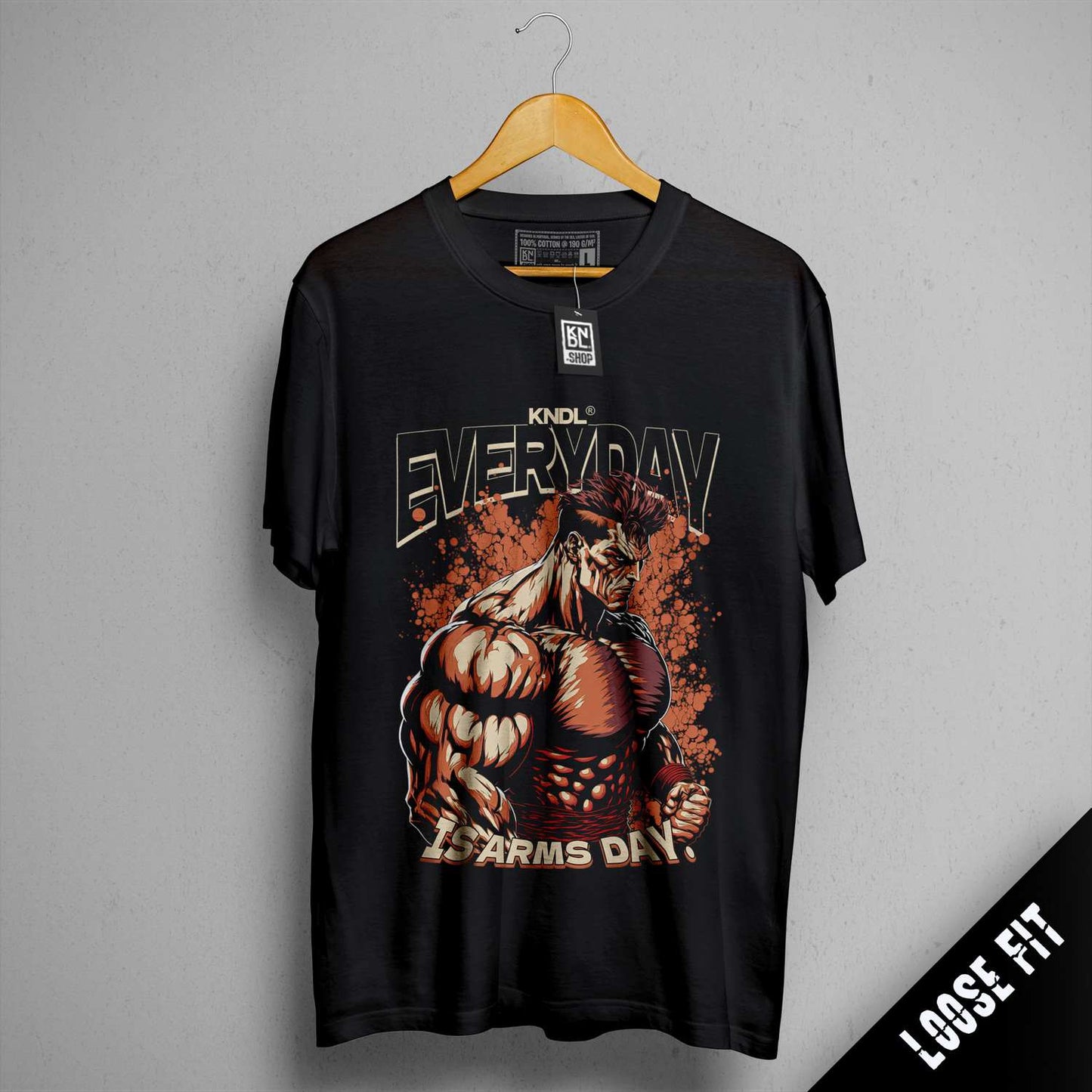 a black t - shirt with a picture of a muscular man on it