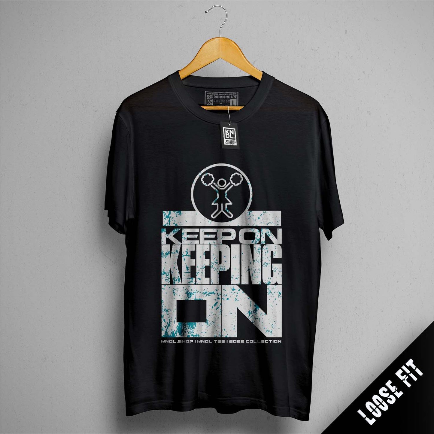 a black t - shirt with the words keep on keeping on