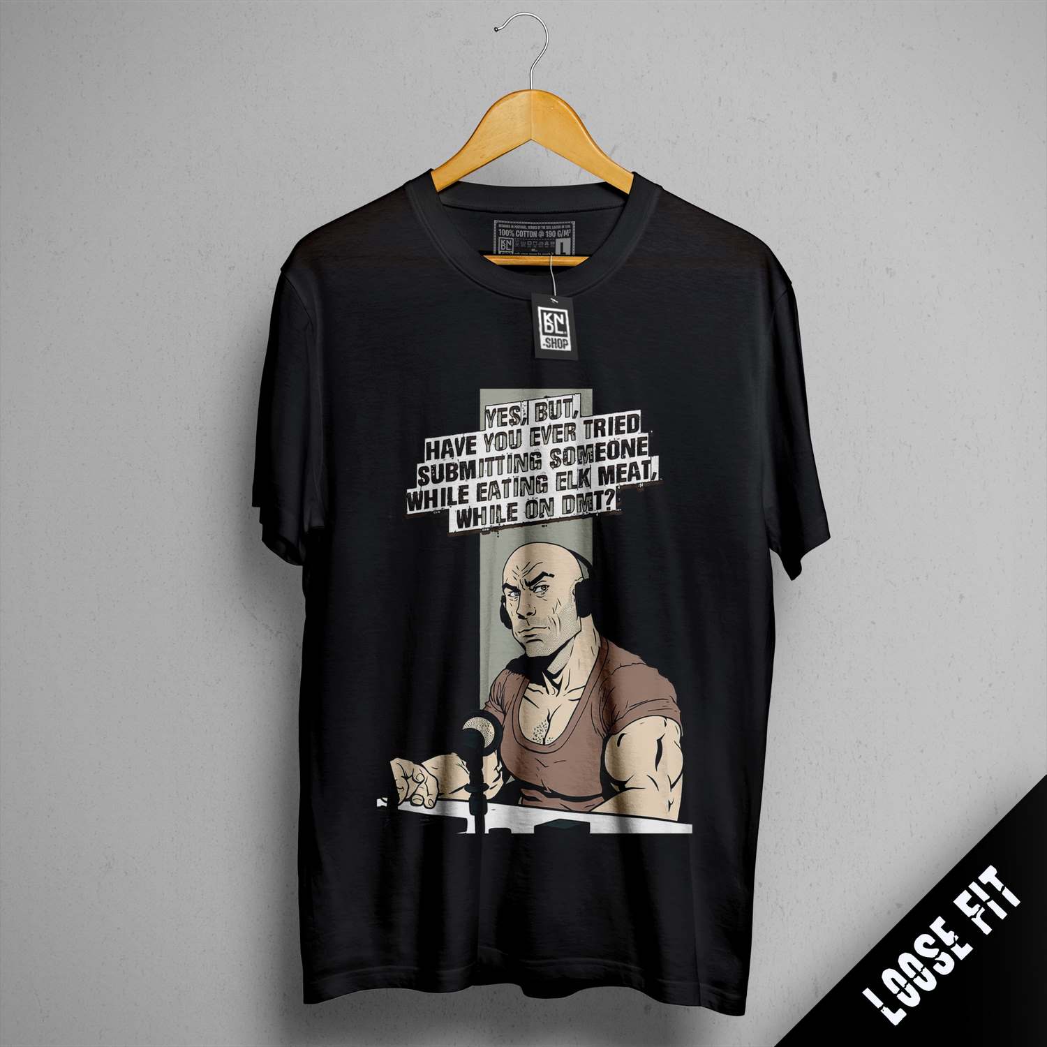 a t - shirt with a picture of a man holding a gun