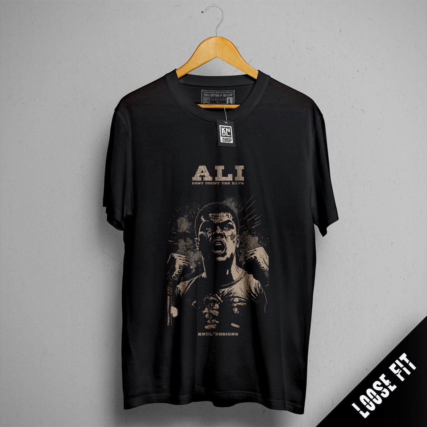 a black shirt with a picture of a man holding a baseball bat