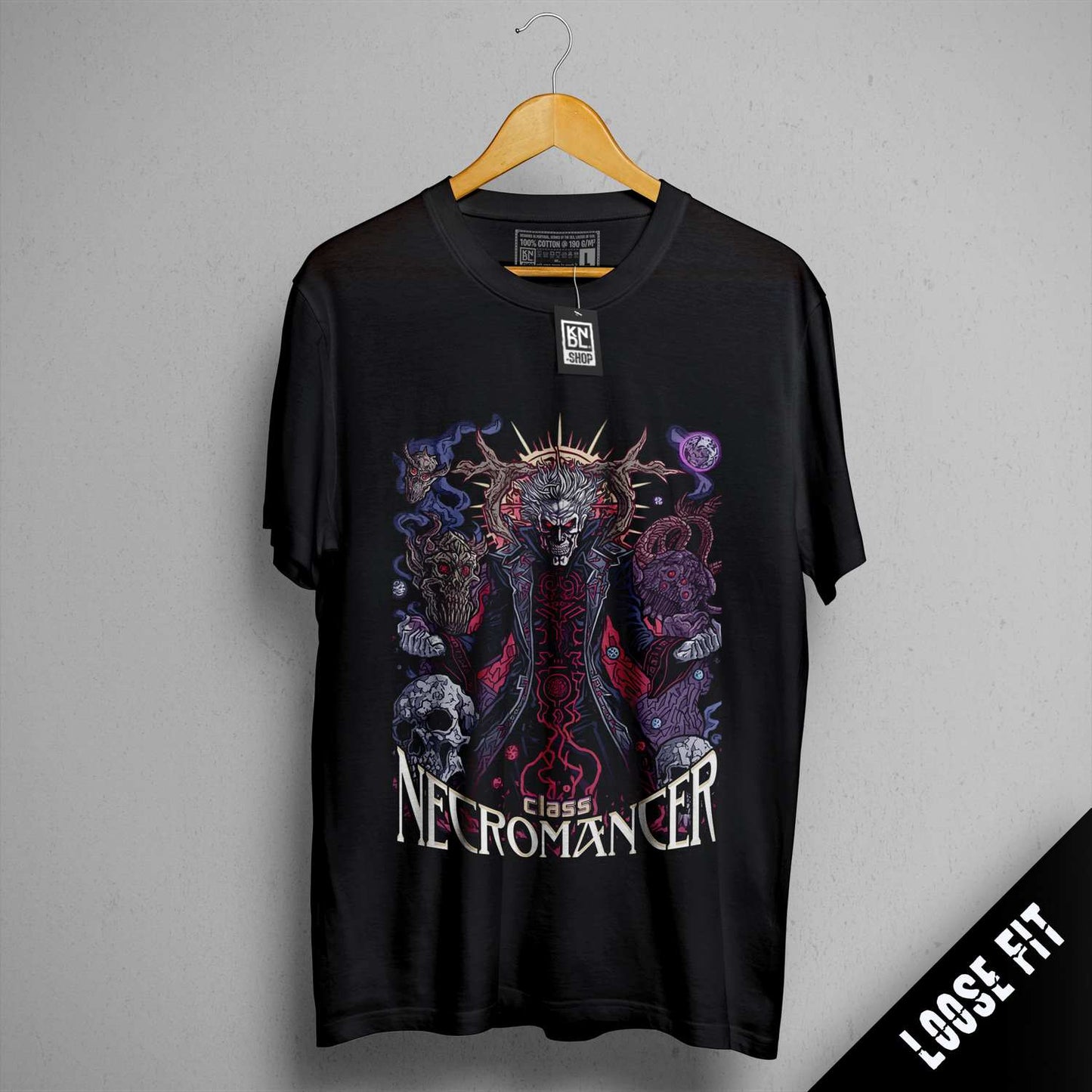 a black t - shirt with a picture of a demon on it