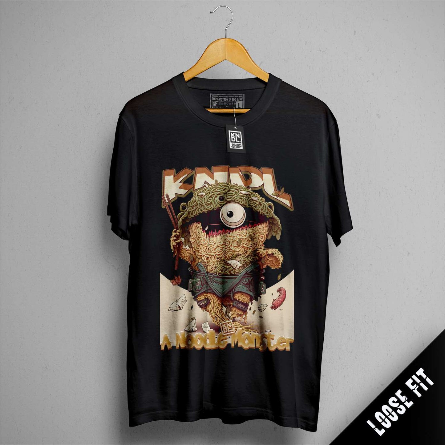 a black t - shirt with a picture of a teddy bear on it