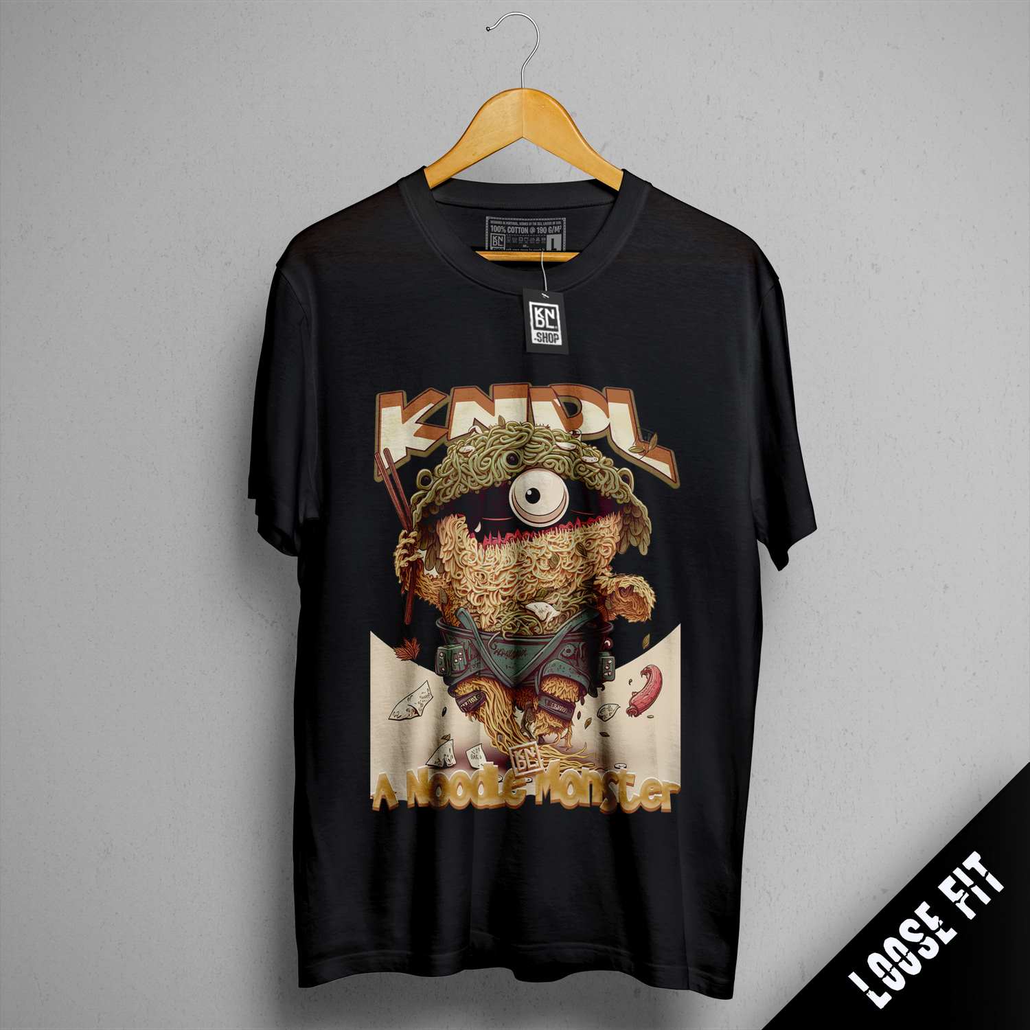 a black t - shirt with a picture of a teddy bear on it