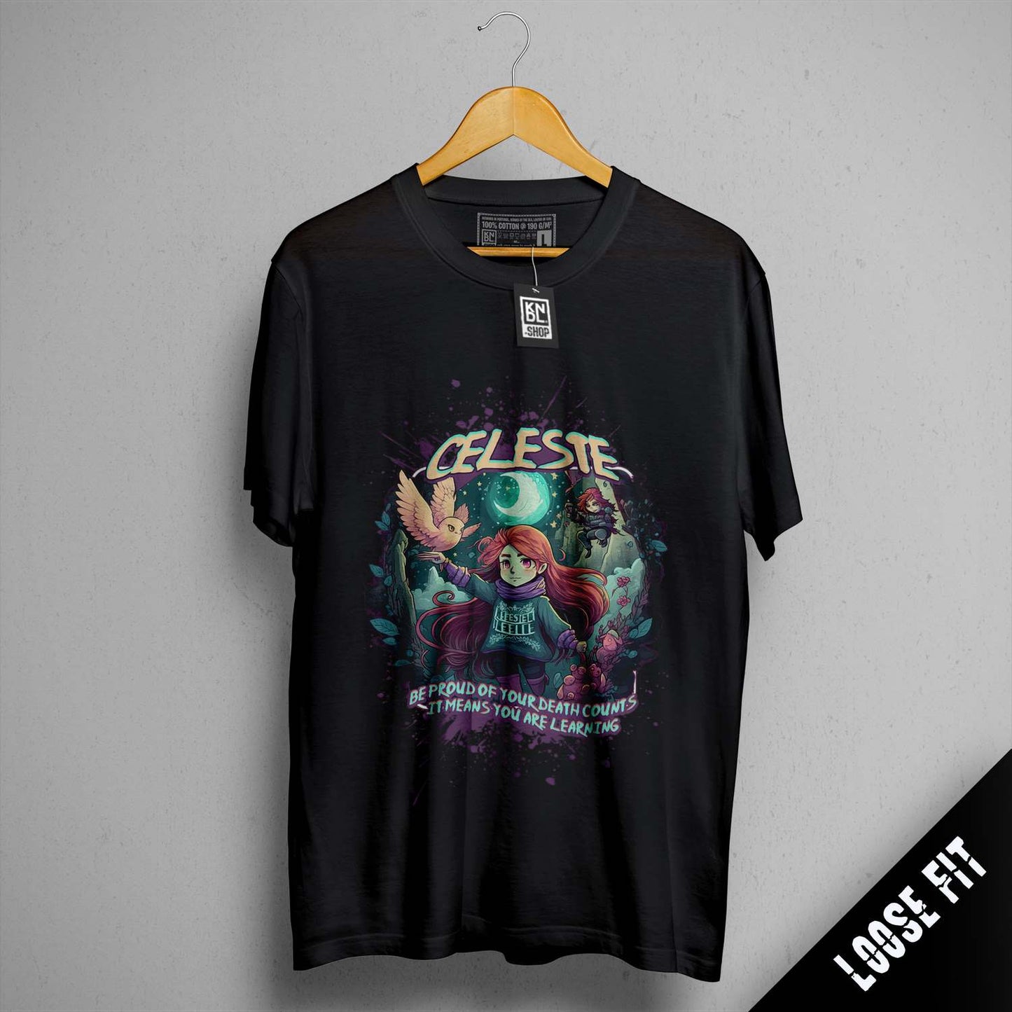 a black t - shirt with a picture of a girl and a demon on it