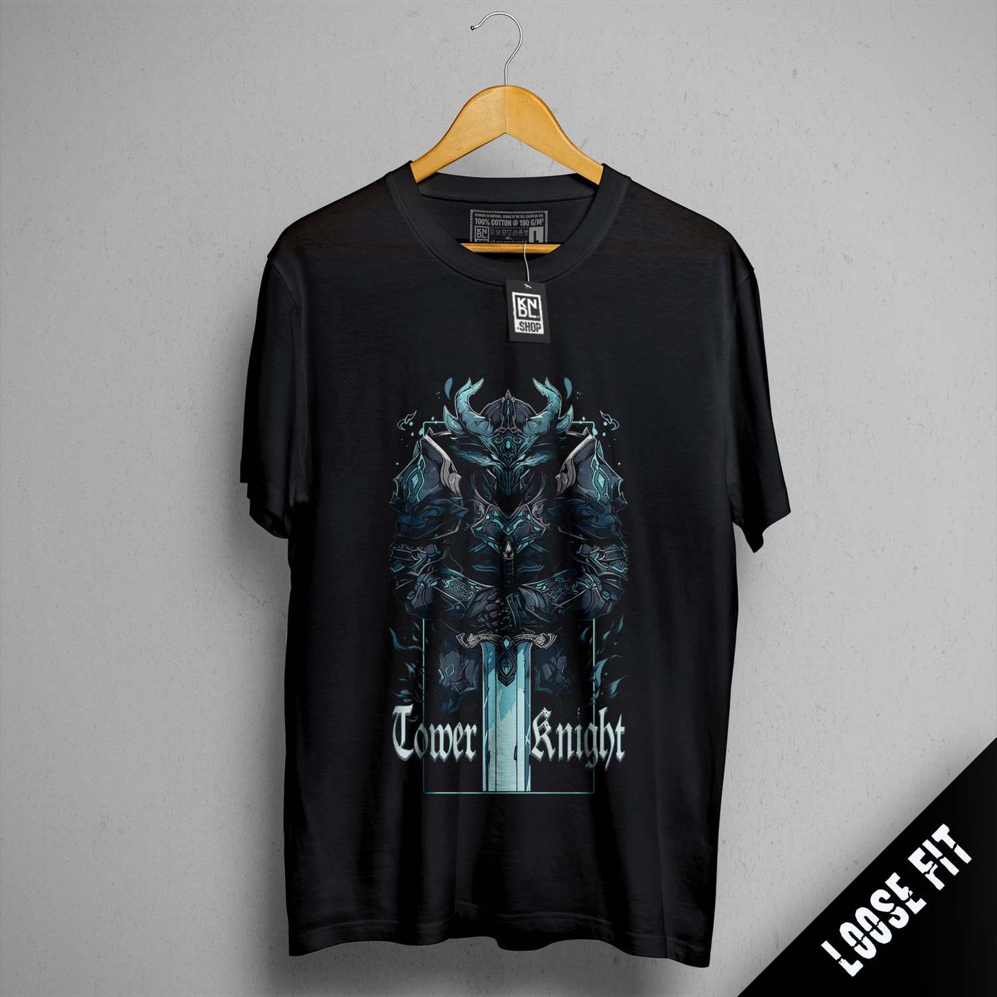 a black t - shirt hanging on a hanger
