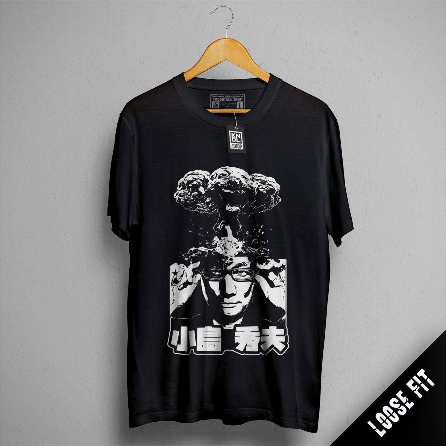 a black shirt with a picture of a man holding a gun
