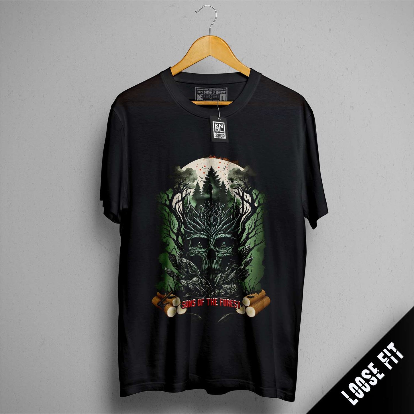 a black t - shirt with a picture of a tree and a skull on it