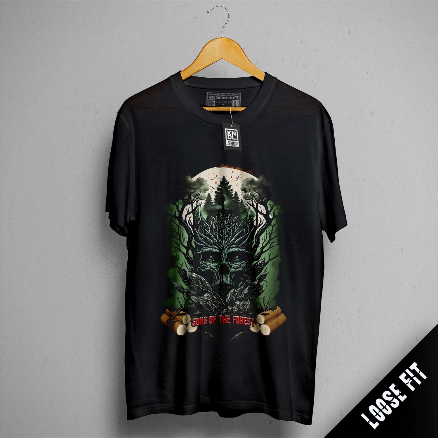 a black t - shirt with a picture of a tree and a skull on it