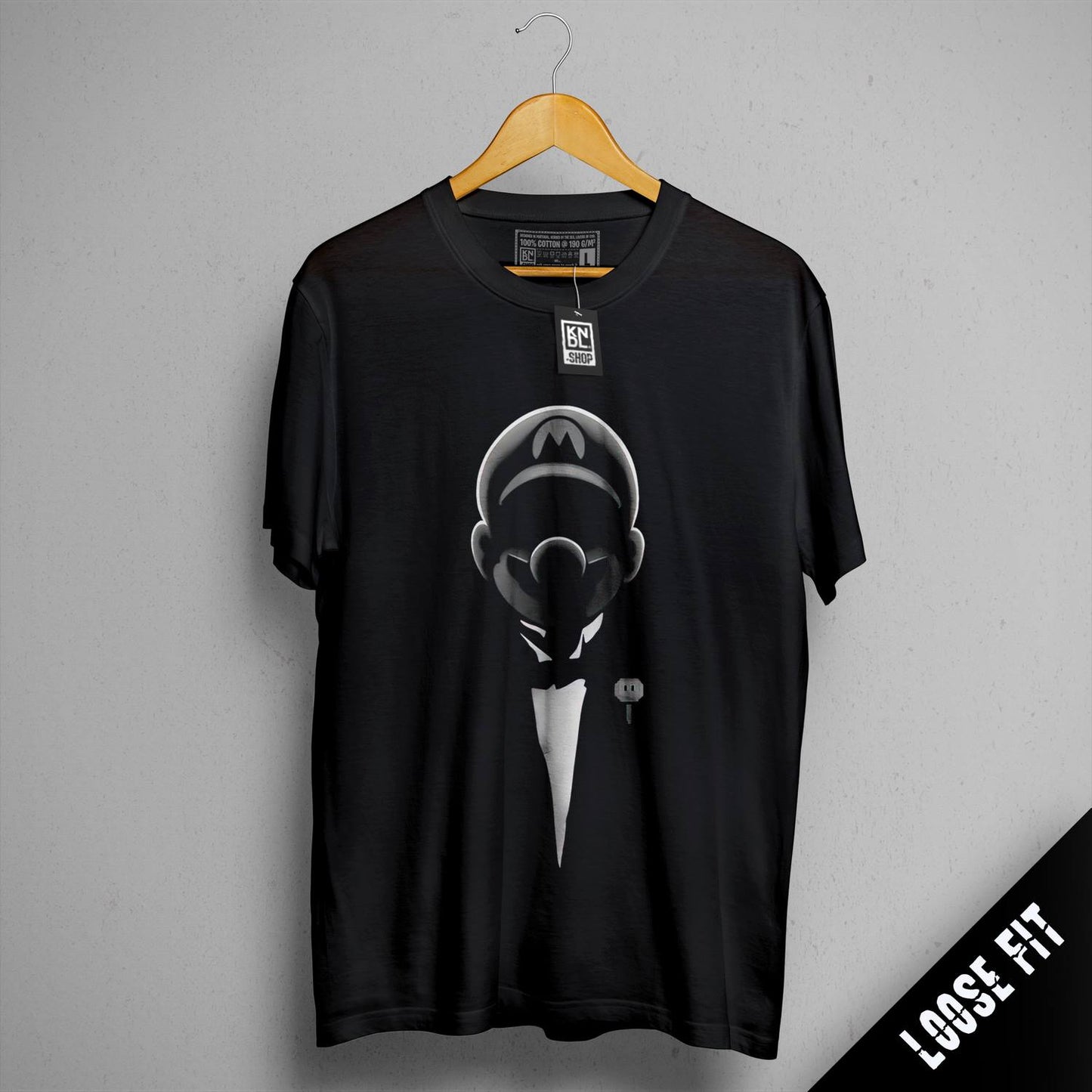 a black t - shirt with a picture of a man in a tuxedo
