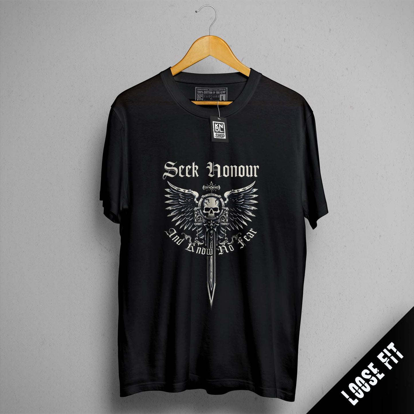 a black t - shirt with a skull and sword on it