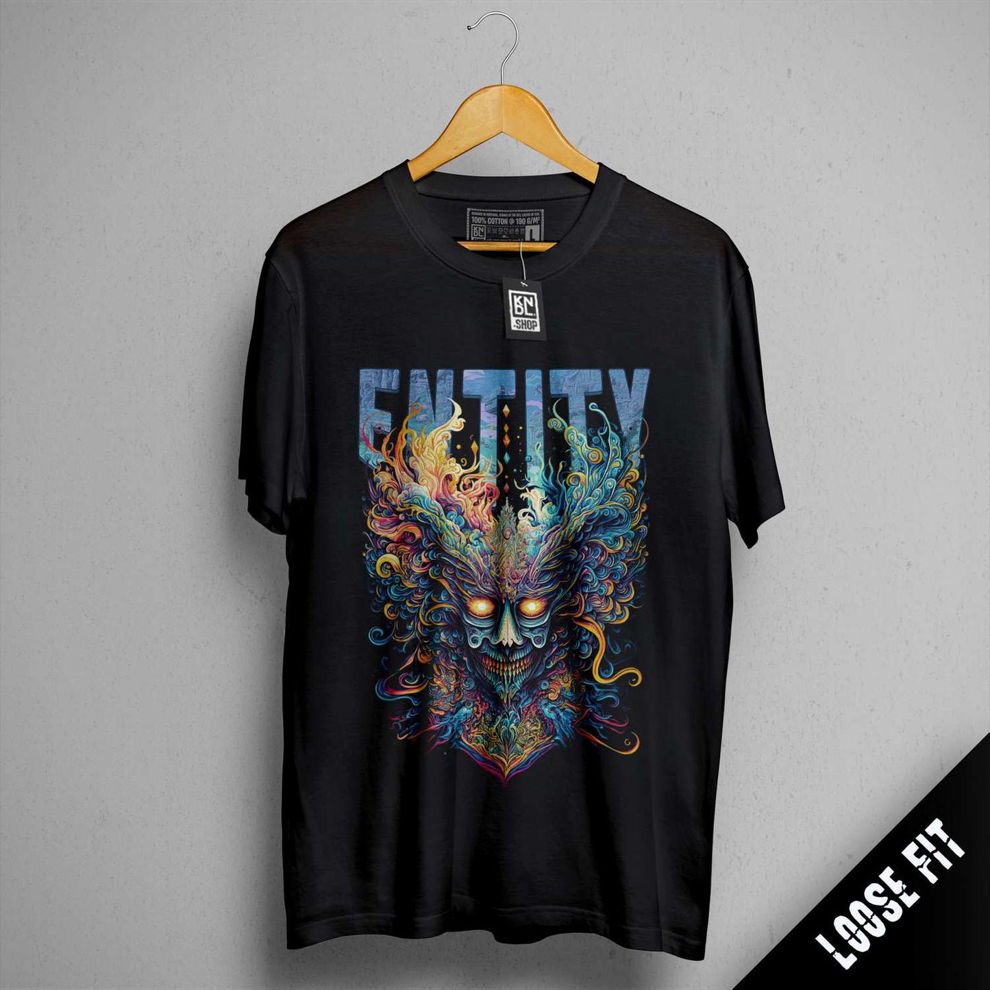 a black t - shirt with an image of a demon on it