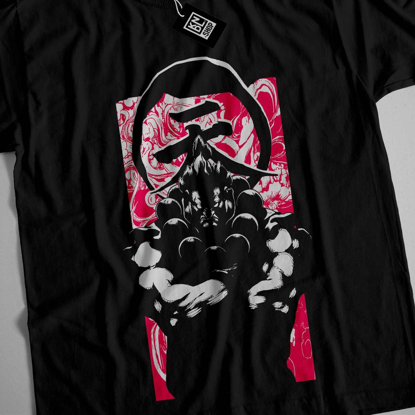 a black t - shirt with a picture of a person holding a steering wheel