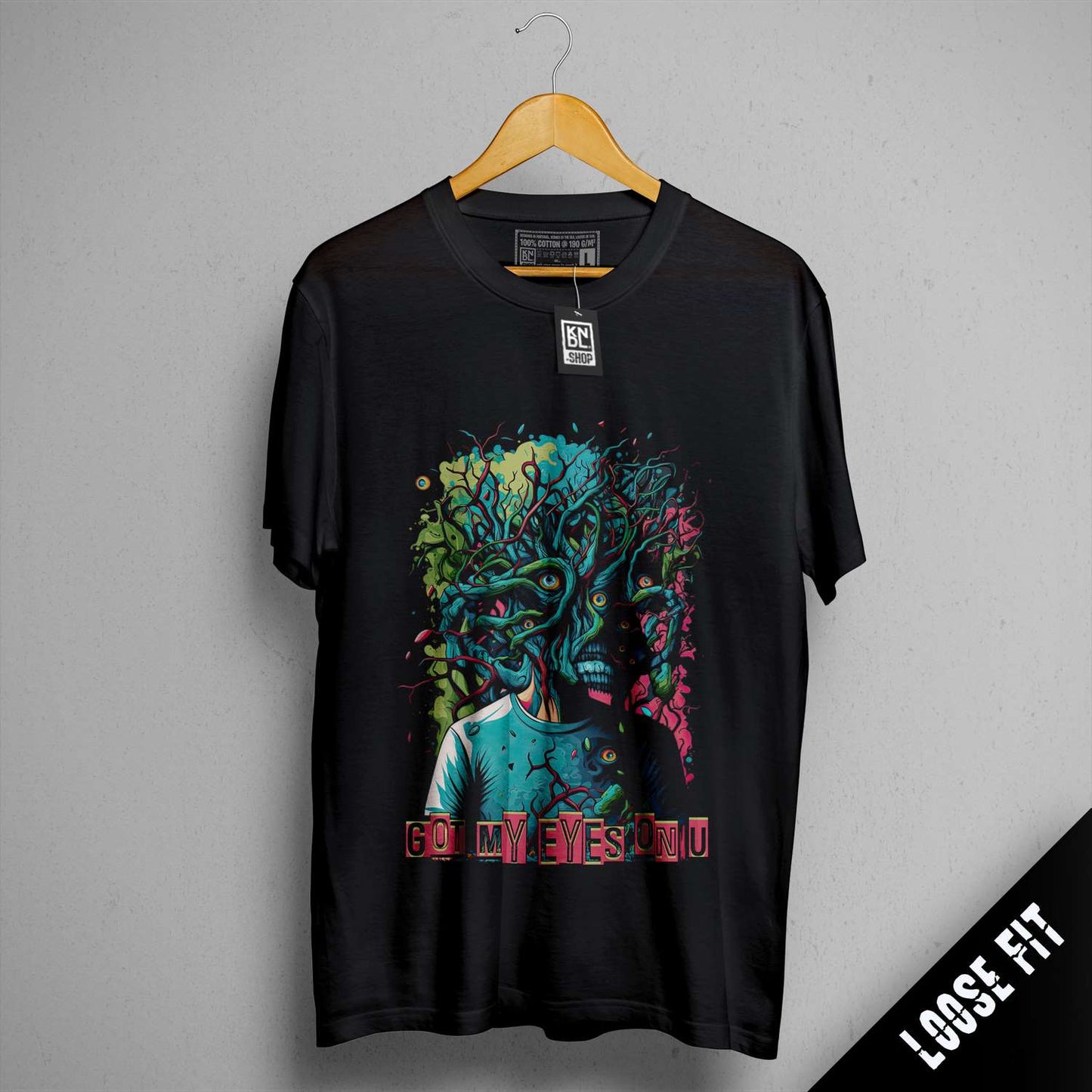 a black t - shirt with a picture of a man's face on it