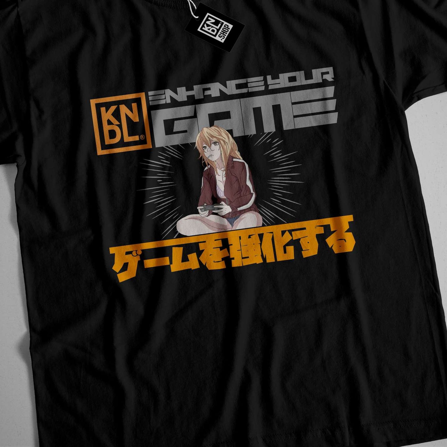 a black t - shirt with a picture of a woman sitting on the floor