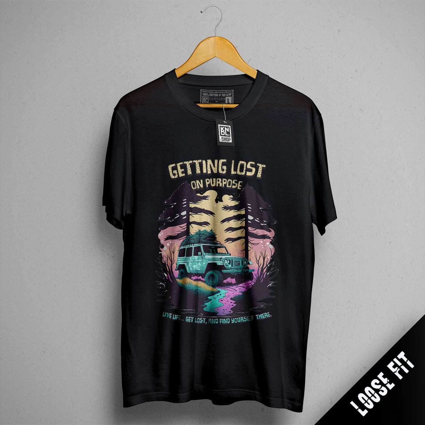 a black t - shirt with a picture of a truck driving down a road