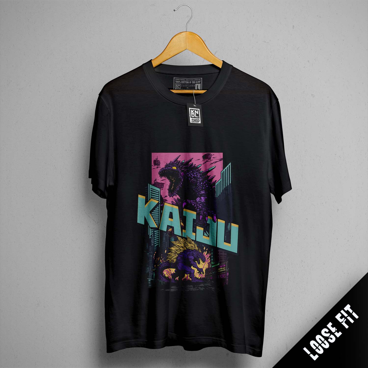 a black t - shirt with a picture of a godzilla on it
