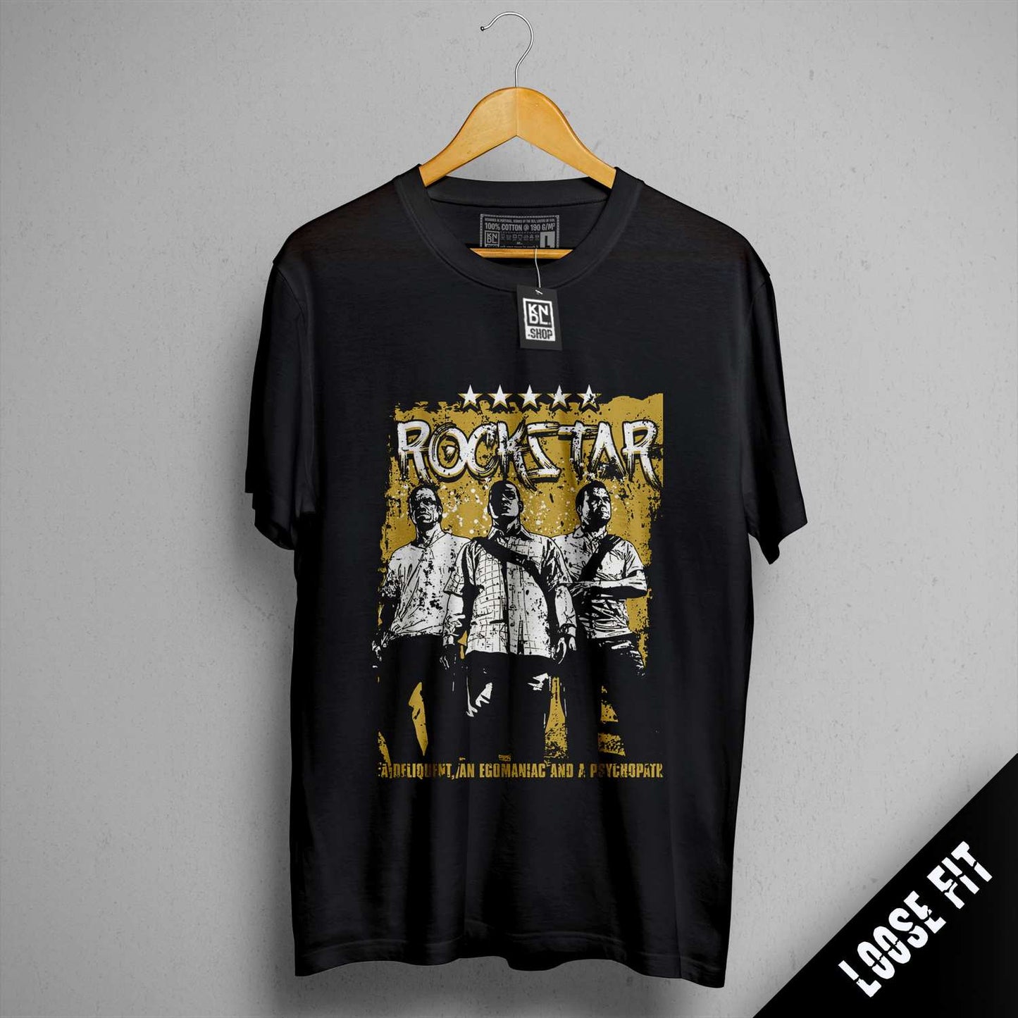 a black rock star t - shirt hanging on a wall