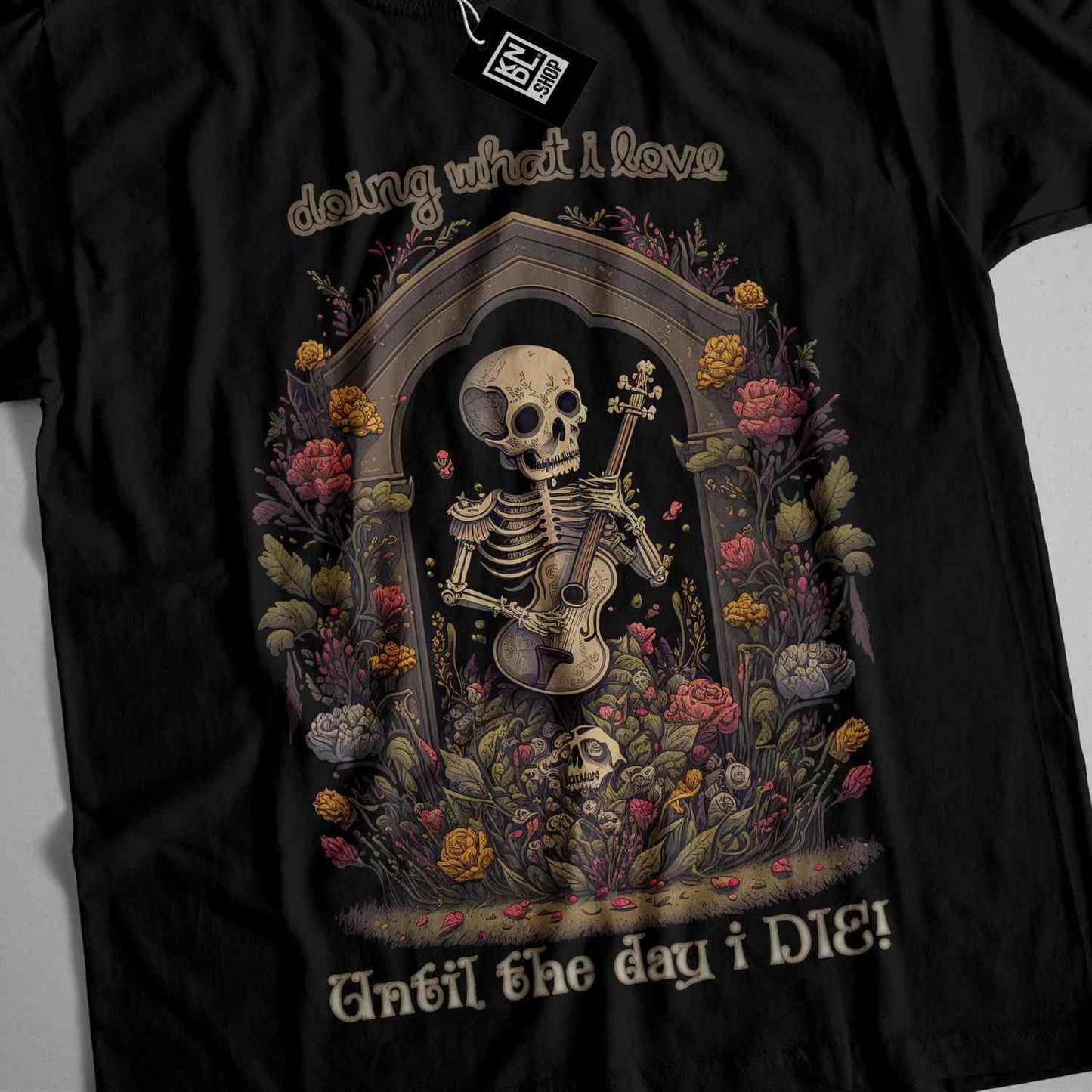 a black t - shirt with a skeleton playing a guitar