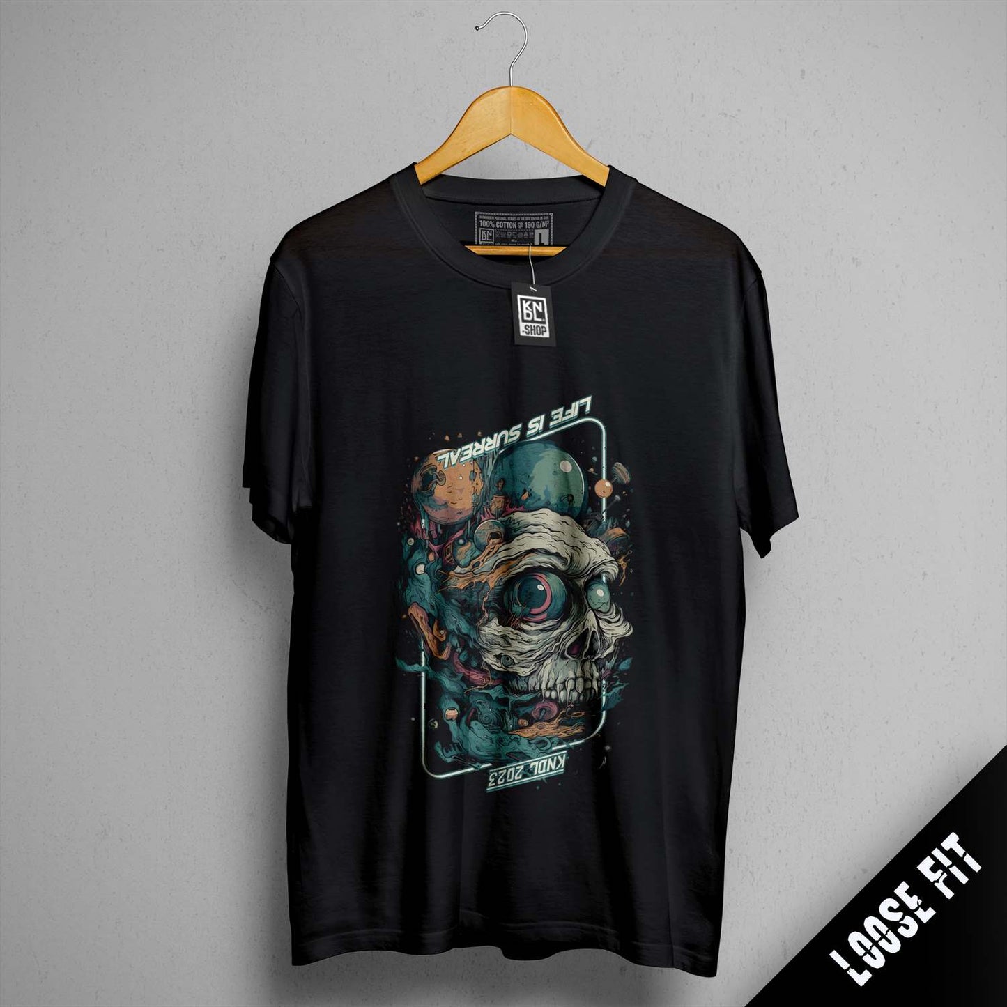 a black t - shirt with a picture of a skull on it