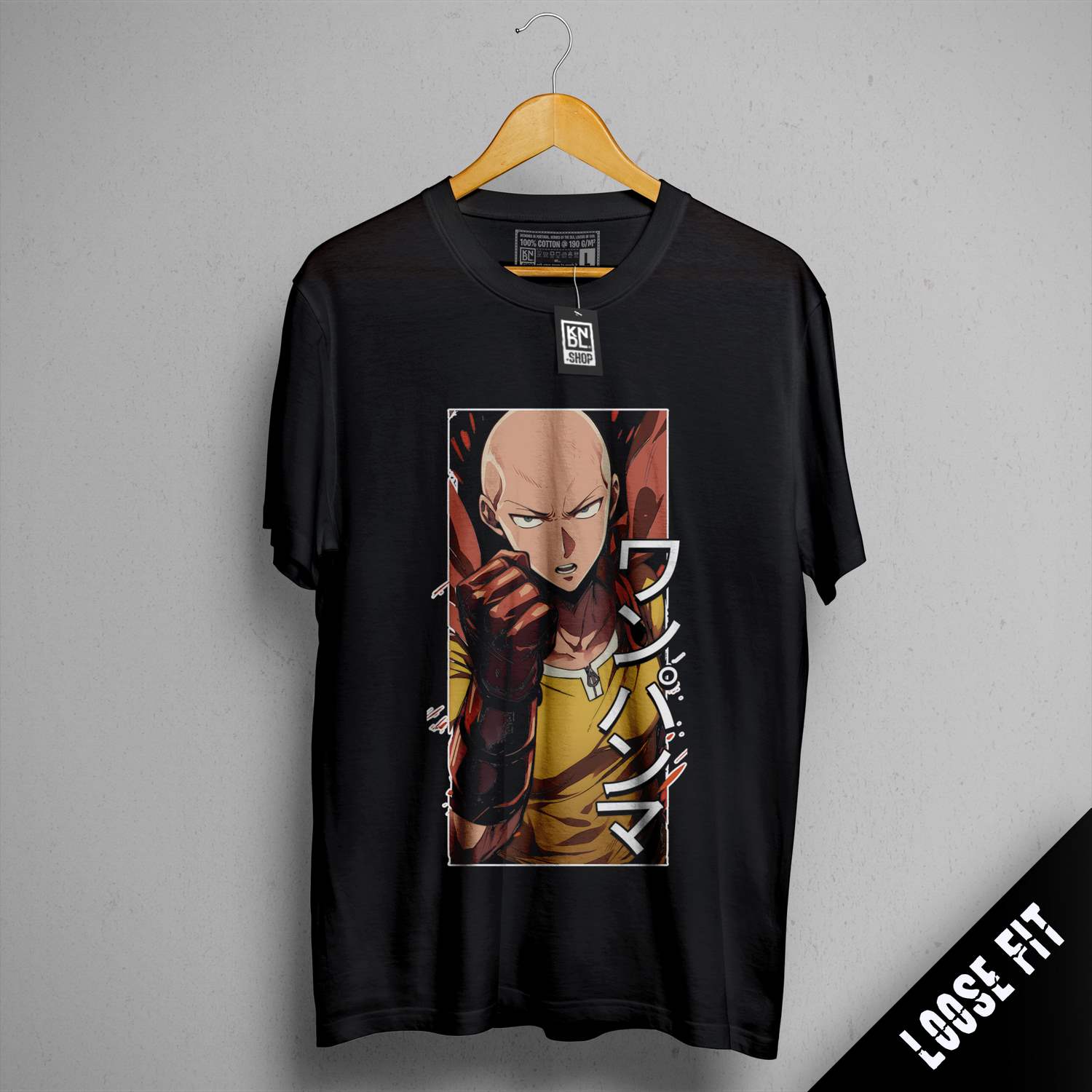 a black shirt with a picture of a man holding a gun