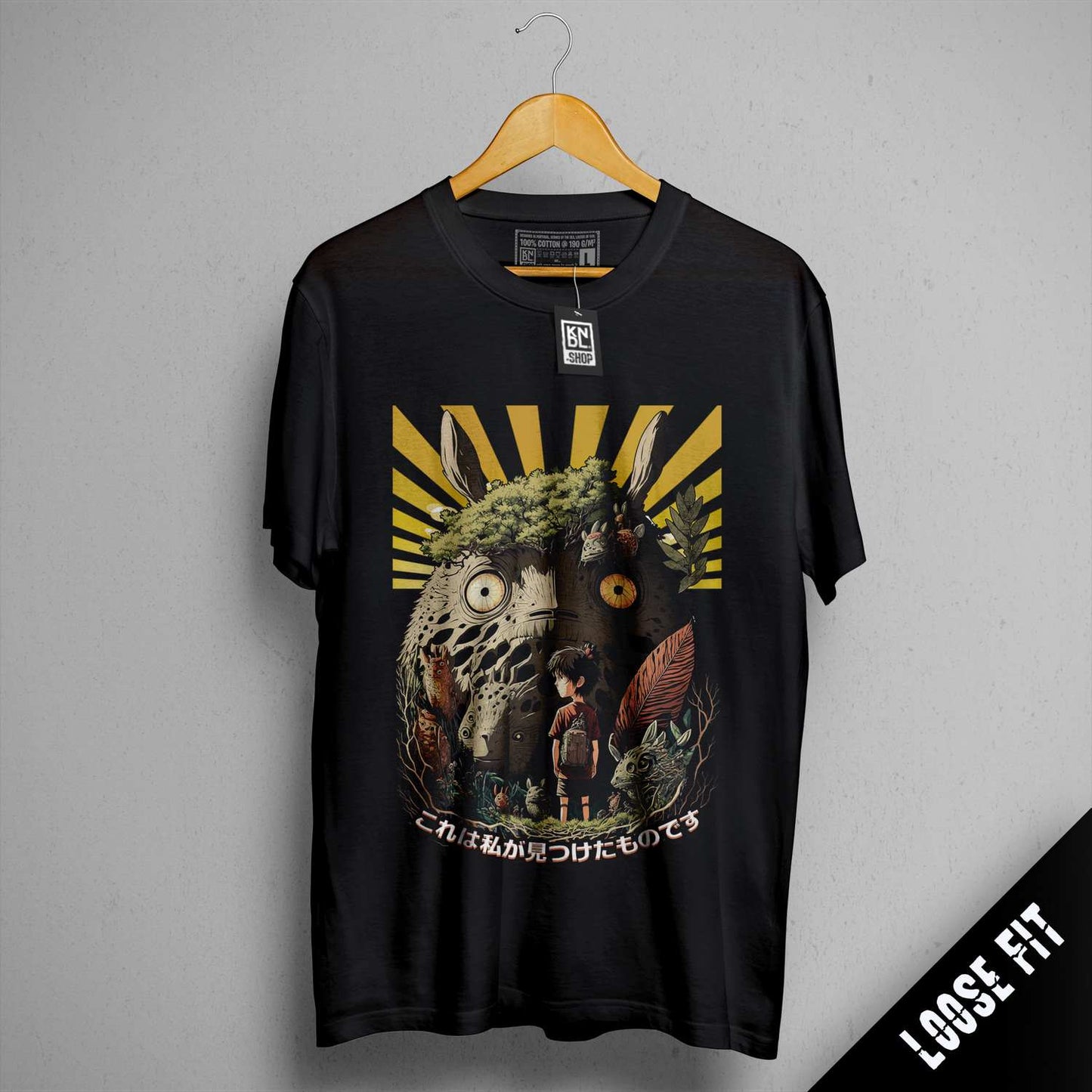 a black t - shirt with a picture of an elephant and a man on it