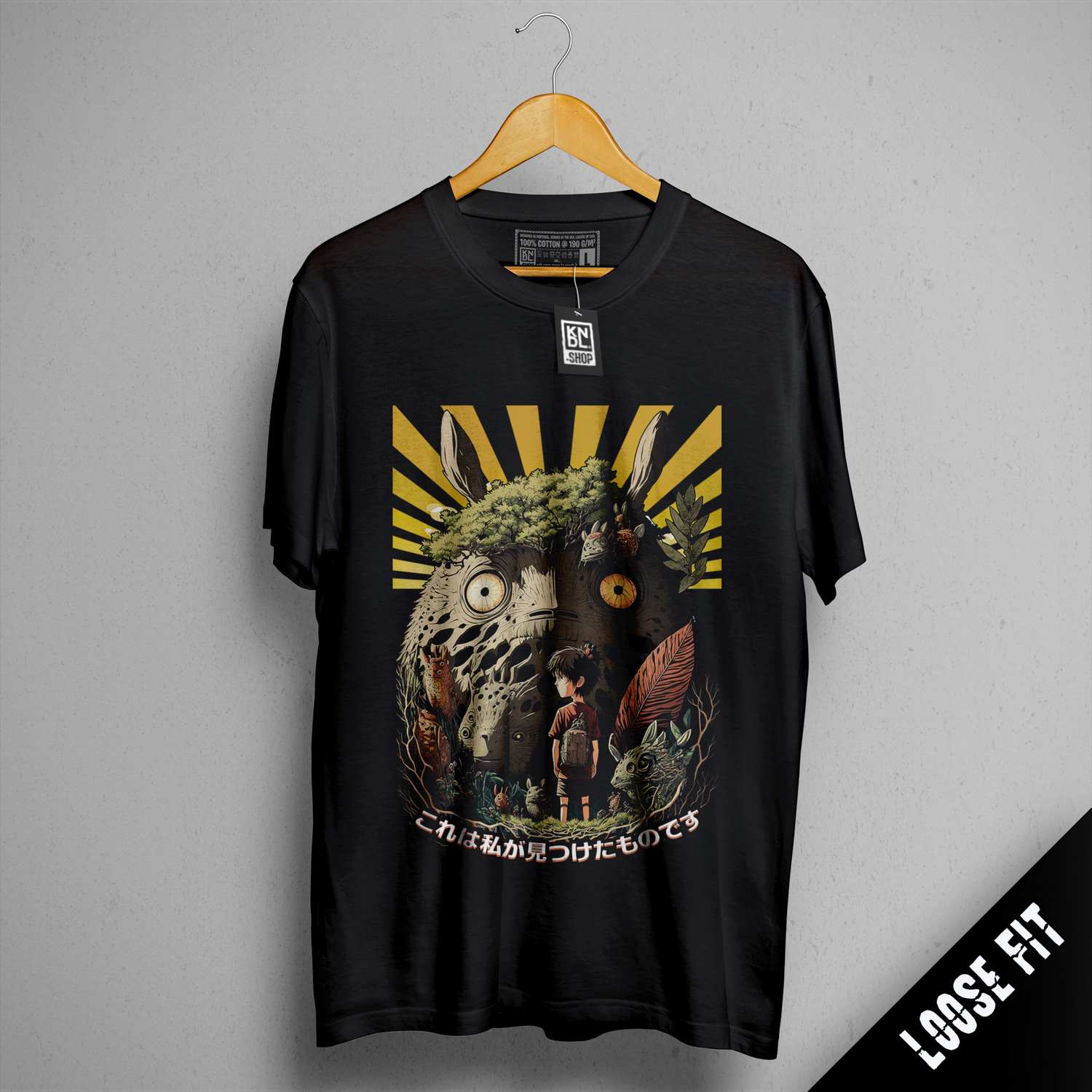 a black t - shirt with a picture of an elephant and a man on it