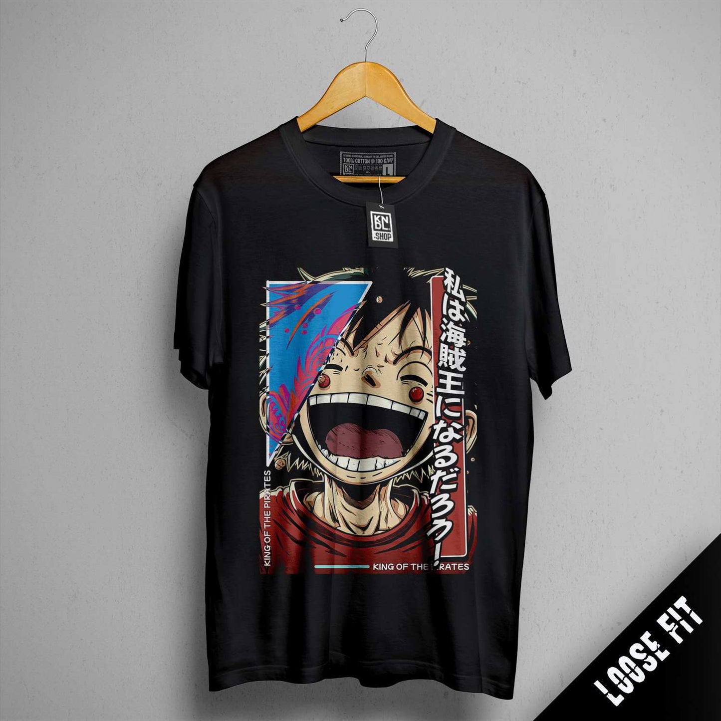 a black t - shirt with a picture of a man laughing