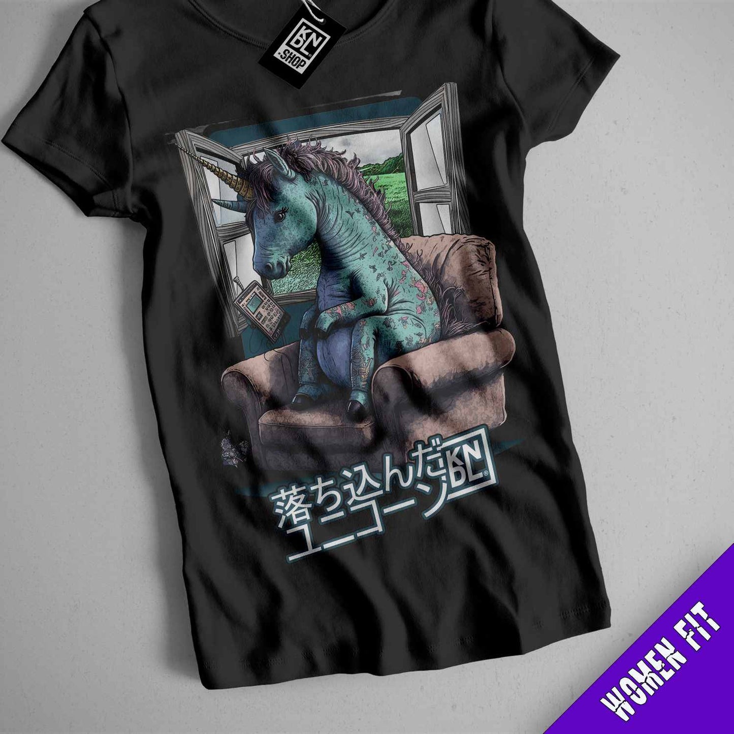 a t - shirt with a picture of a godzilla sitting on a couch